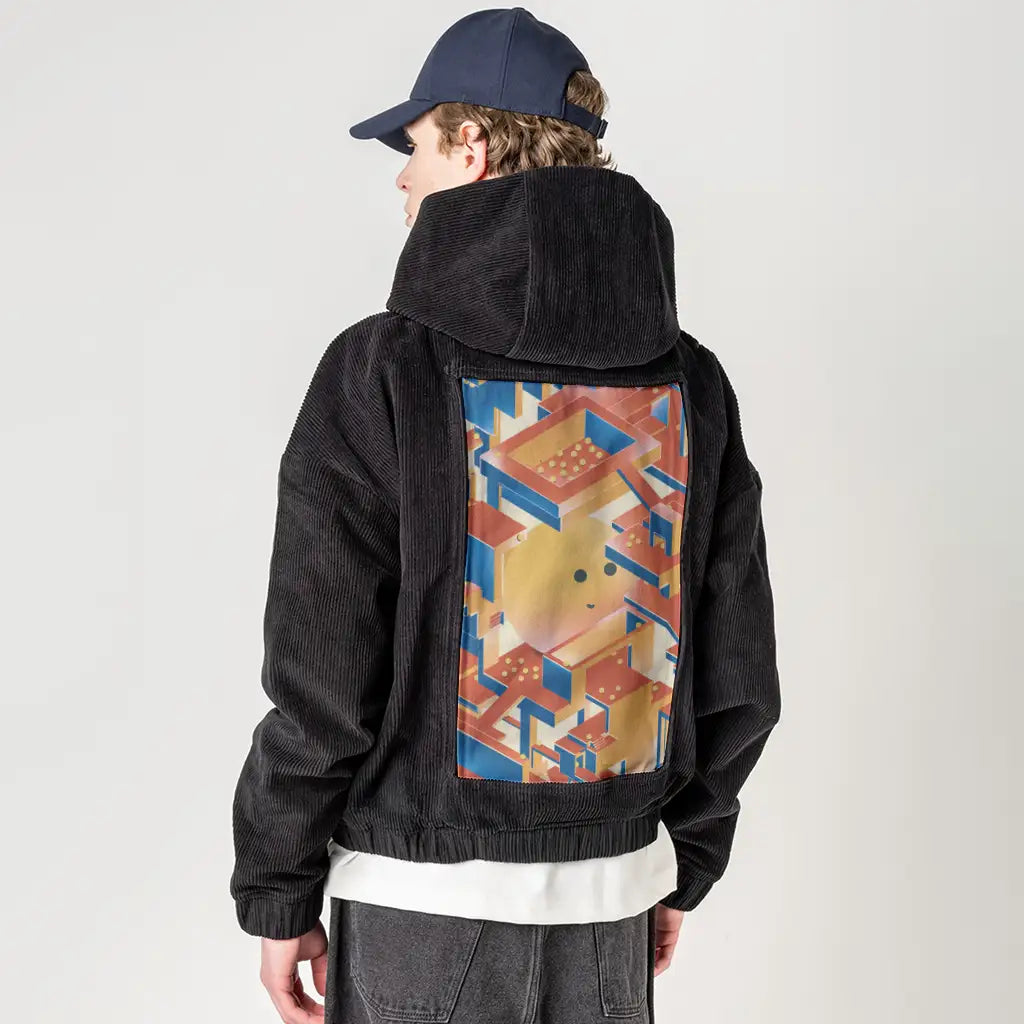 newperspectives patch on male retro cord hoodie in onyx