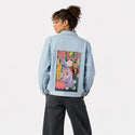 noneofyourbusiness patch on female og denim jacket in oceanside
