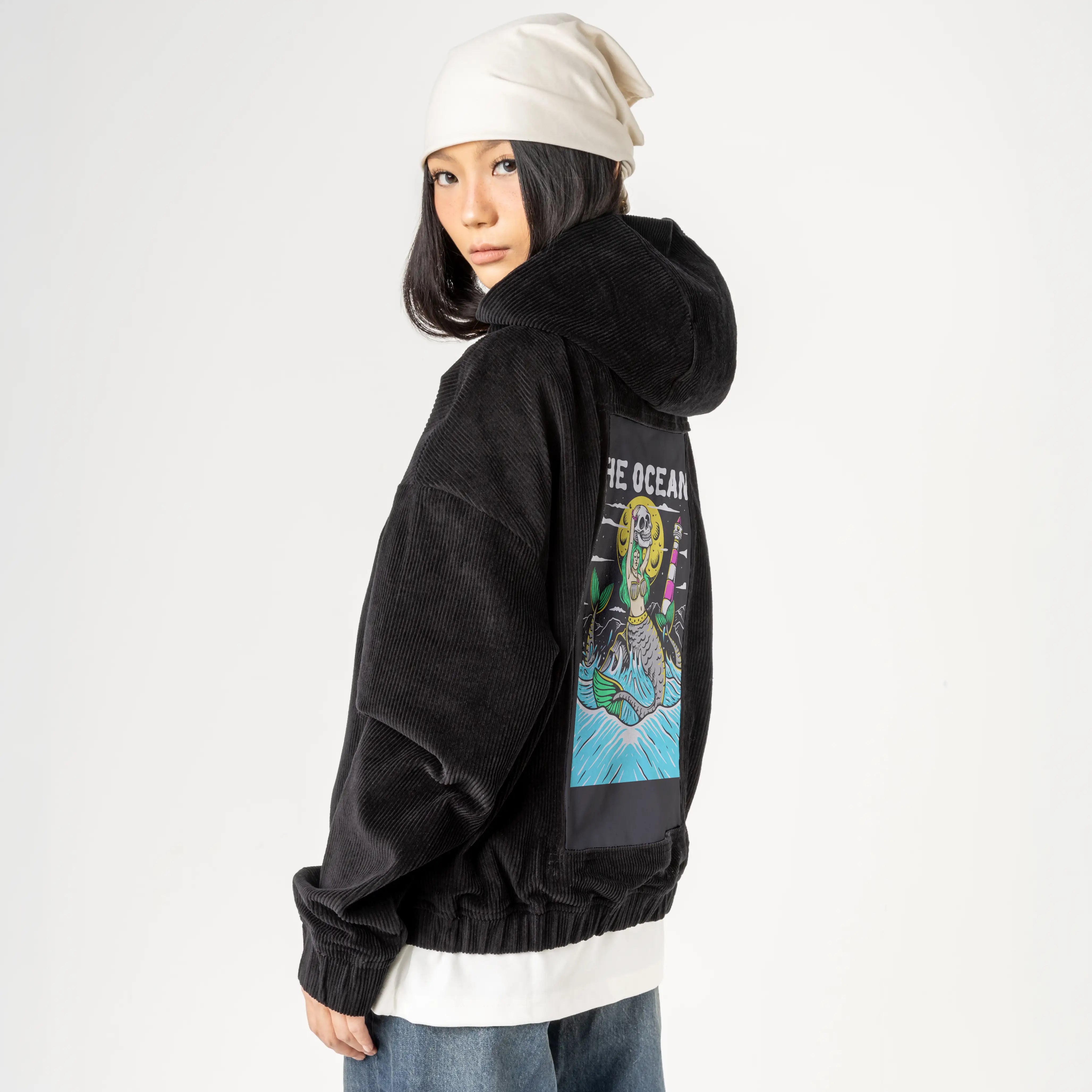 ocean patch on female retro cord hoodie in onyx