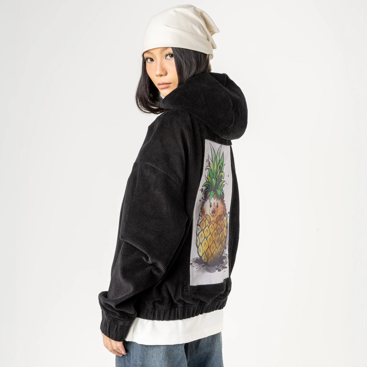 pineapplehedgehog patch on female retro cord hoodie in onyx