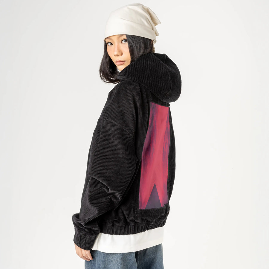 reddream patch on female retro cord hoodie in onyx