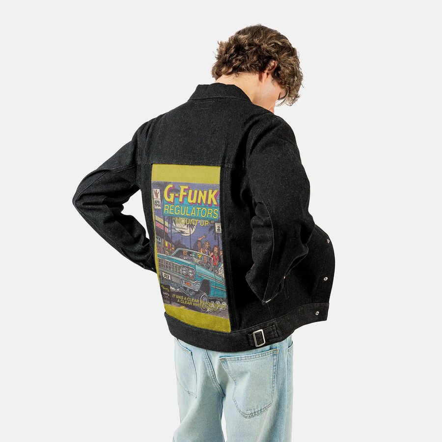 regulate patch on male og denim jacket in raven