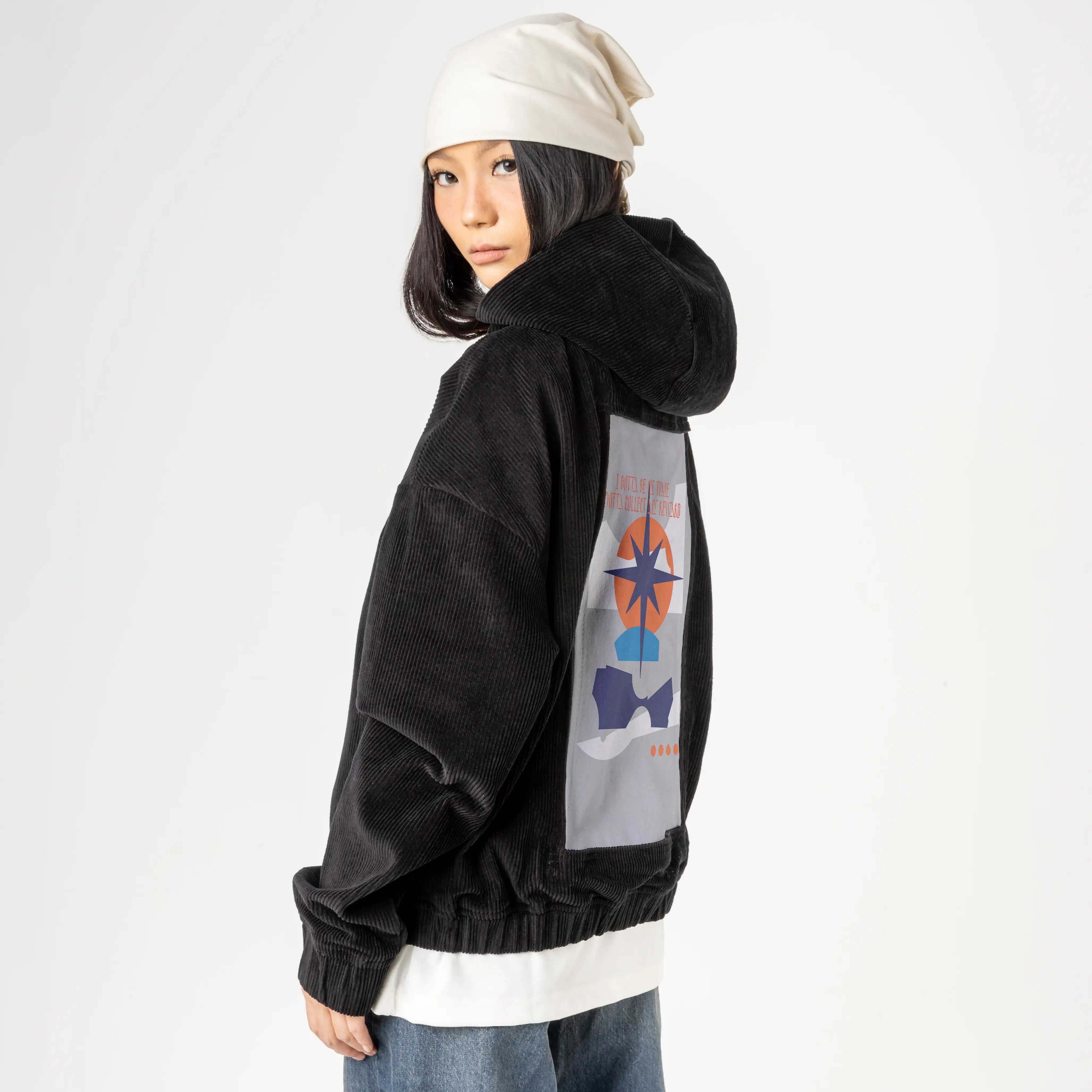 reward patch on female retro cord hoodie in onyx