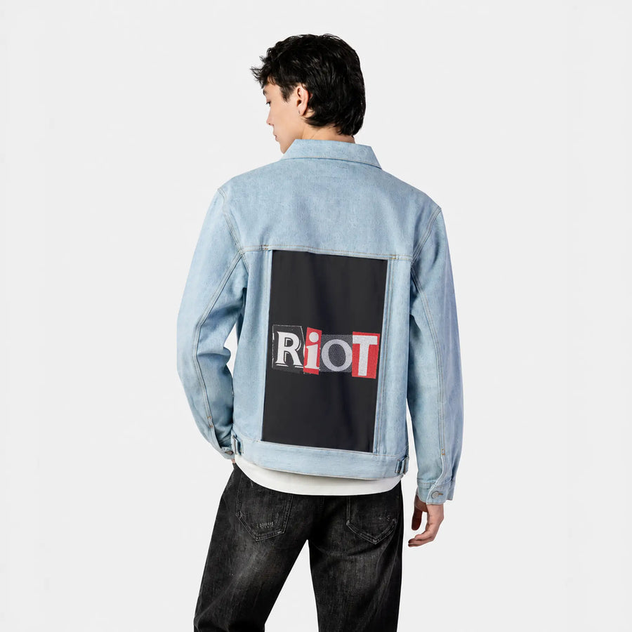 riot patch on male og denim jacket in oceanside