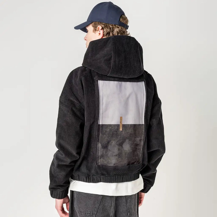 sacredunion patch on male retro cord hoodie in onyx