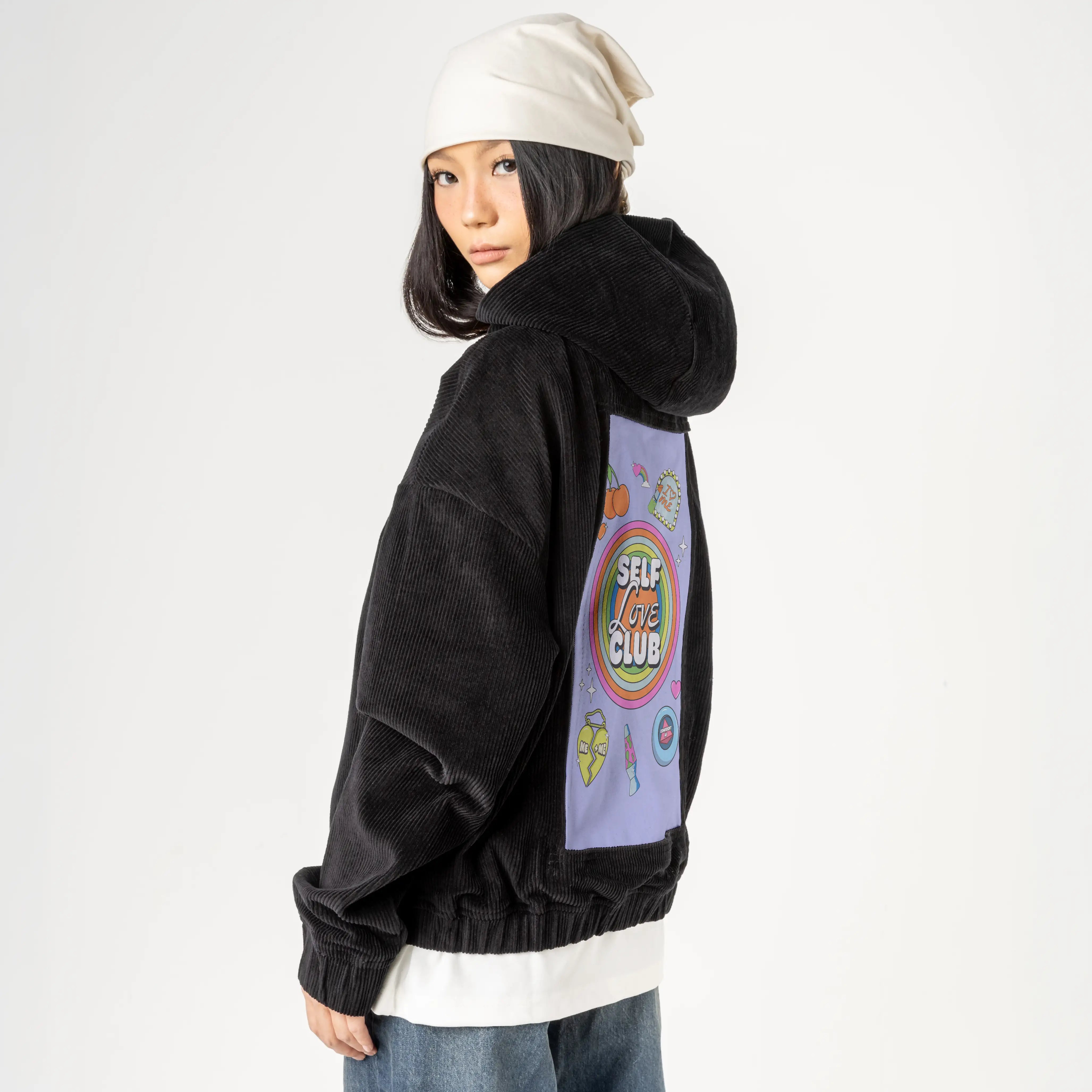 selflove patch on female retro cord hoodie in onyx