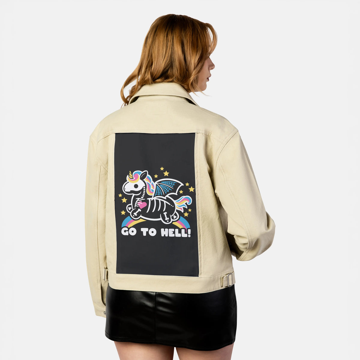 skeletonunicorn patch on female atelier canvas jacket in tan