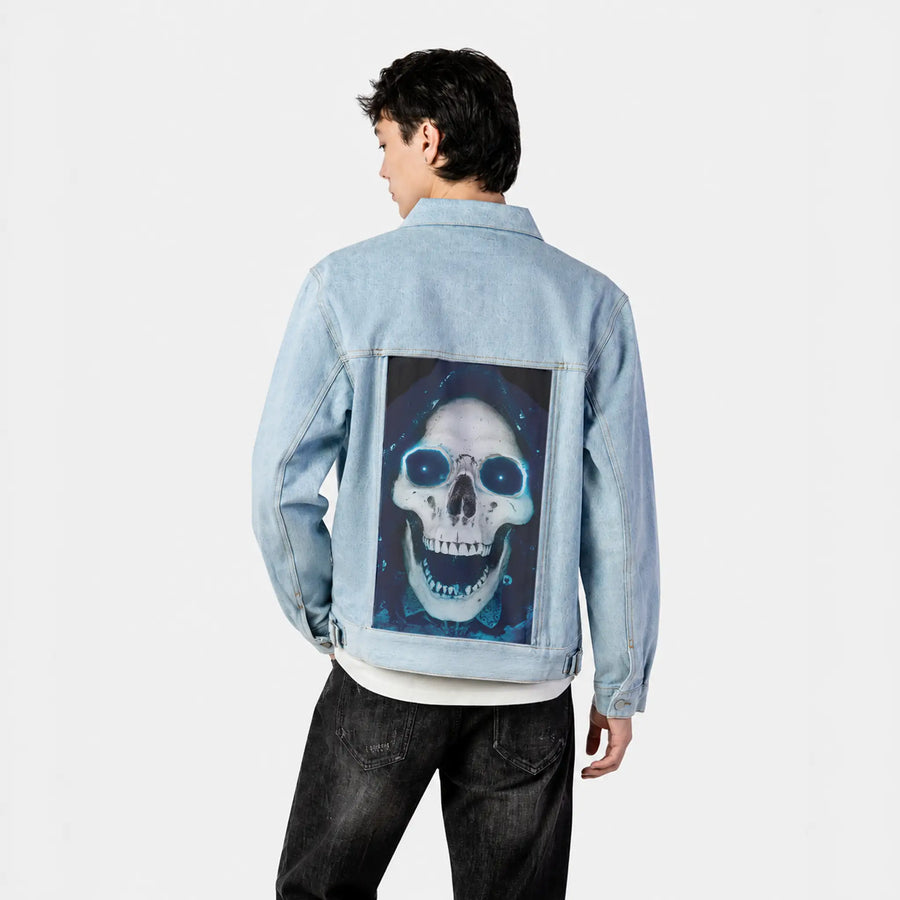 skkull patch on male og denim jacket in oceanside