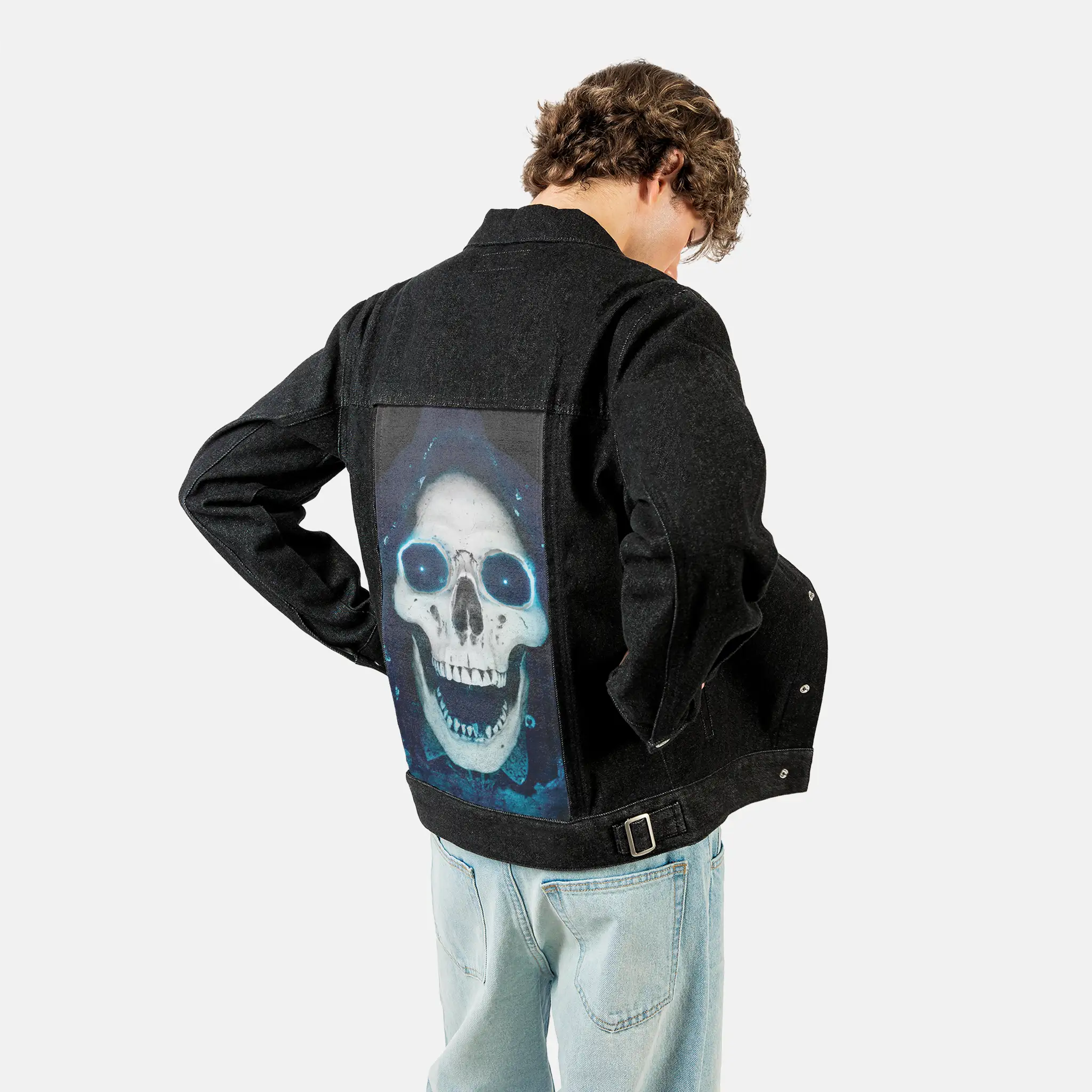 skkull patch on male og denim jacket in raven