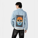 skullsunset patch on male og denim jacket in oceanside