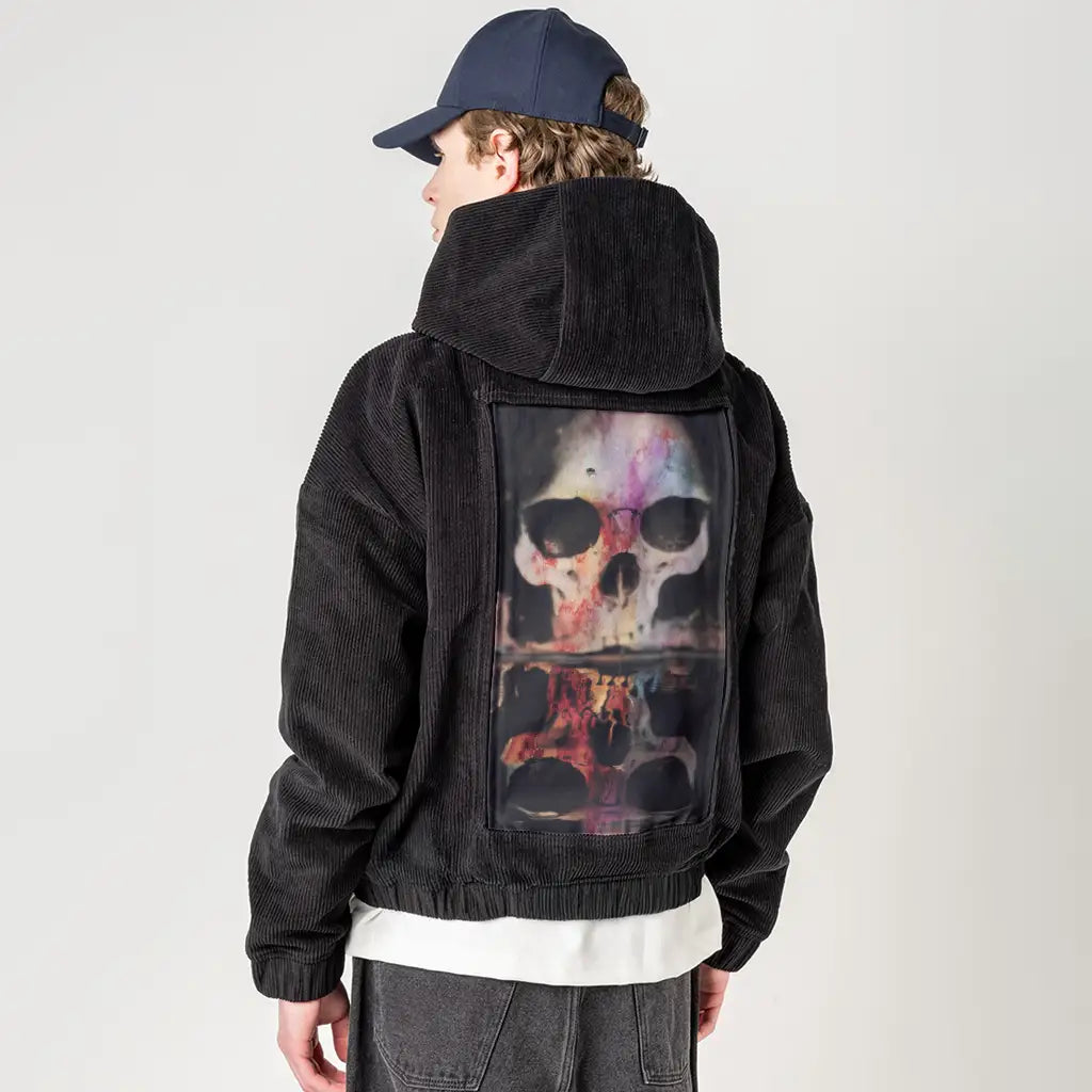 skullwithfly patch on male retro cord hoodie in onyx