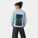 sneakyducky patch on female og denim jacket in oceanside
