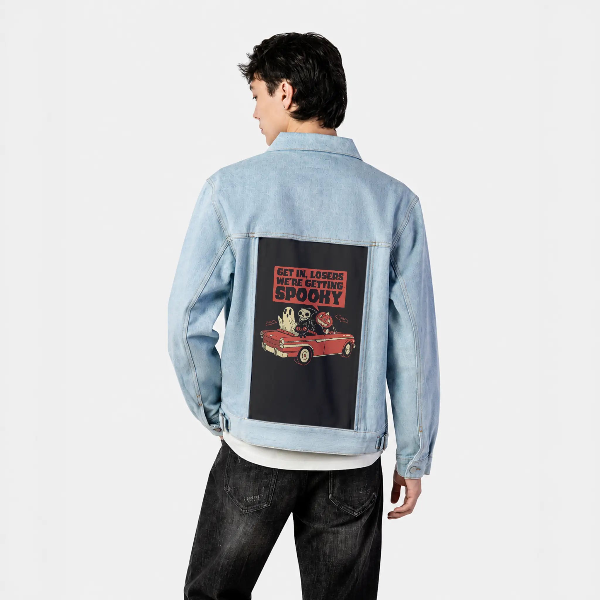 spookyroadtrip patch on male og denim jacket in oceanside