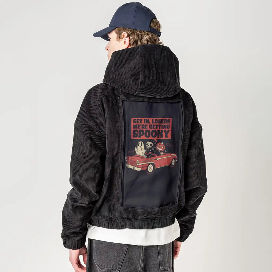 spookyroadtrip patch on male retro cord hoodie in onyx