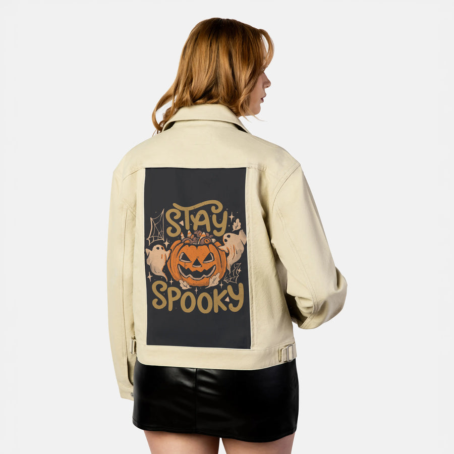 stayspooky patch on female atelier canvas jacket in tan