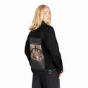 summonspookyseason patch on female og denim jacket in raven