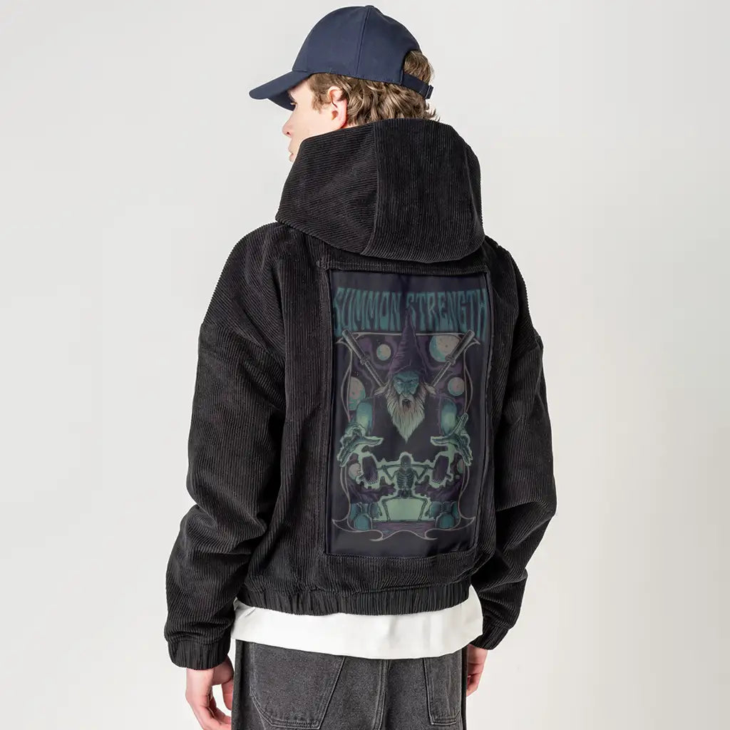 summonstrength patch on male retro cord hoodie in onyx