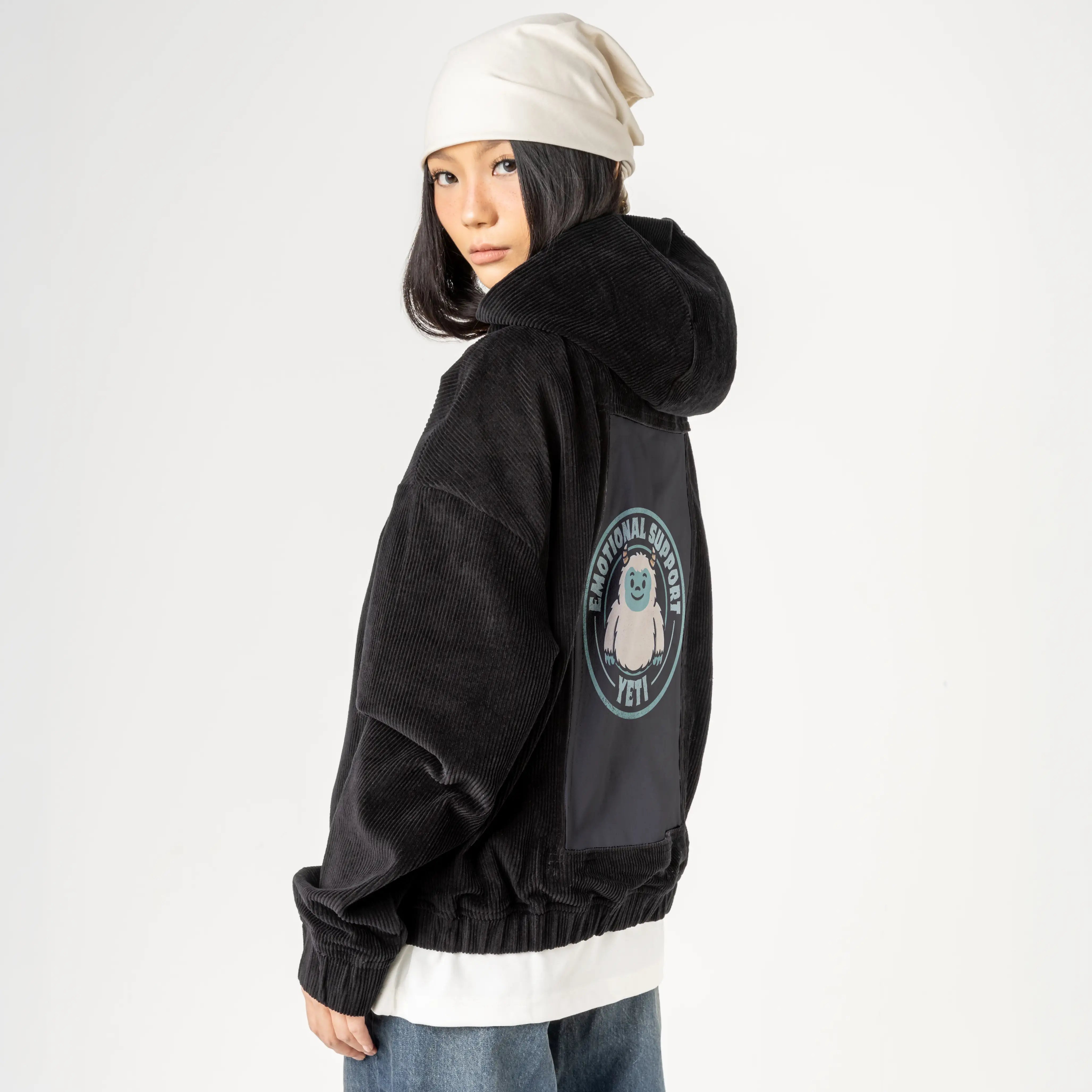 supportyeti patch on female retro cord hoodie in onyx