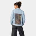 survivalsong patch on female og denim jacket in oceanside