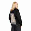tenofcoins patch on female og denim jacket in raven