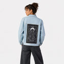 thecall patch on female og denim jacket in oceanside