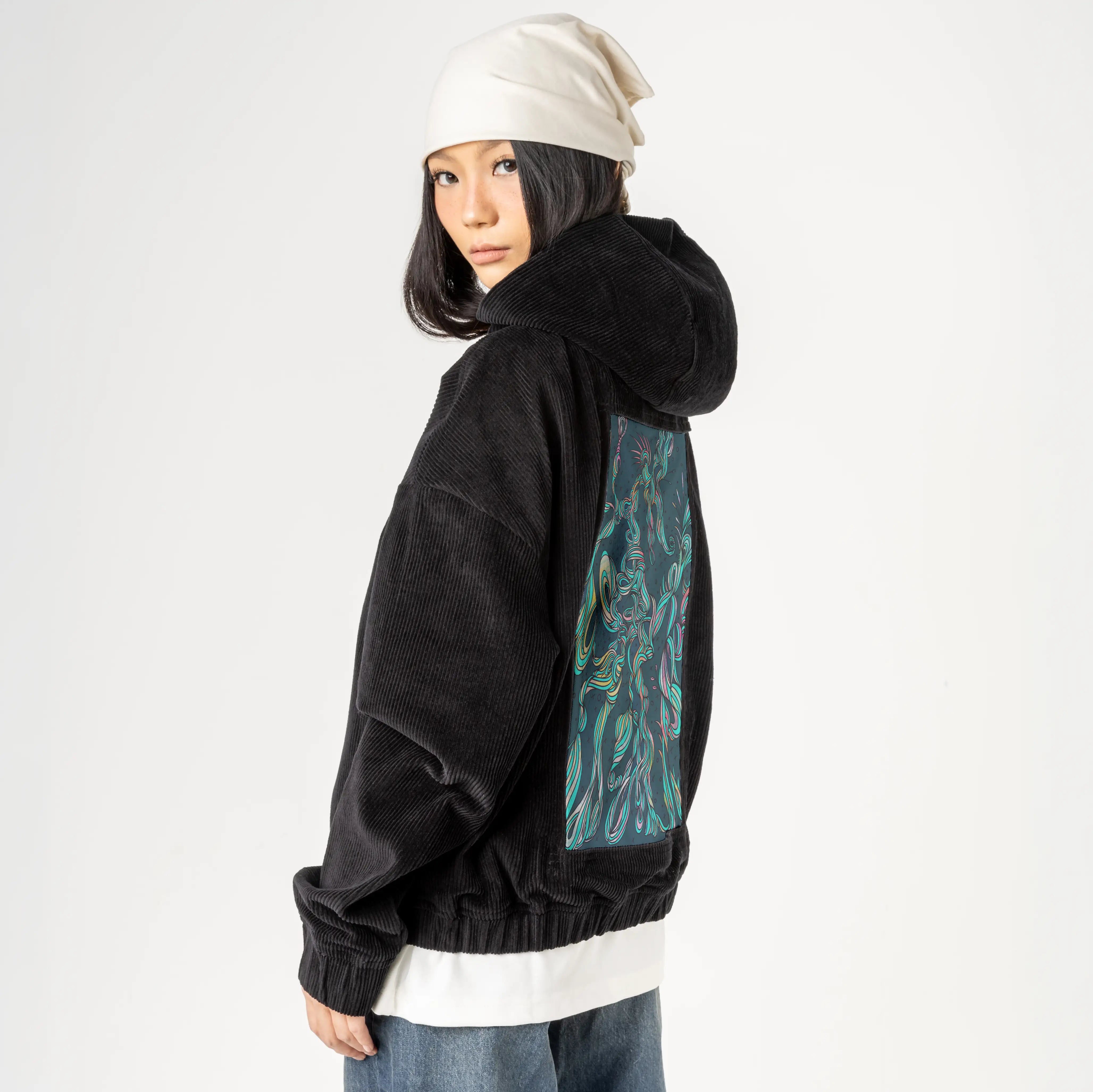 twisted patch on female retro cord hoodie in onyx