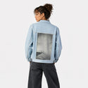 vertigocean patch on female og denim jacket in oceanside