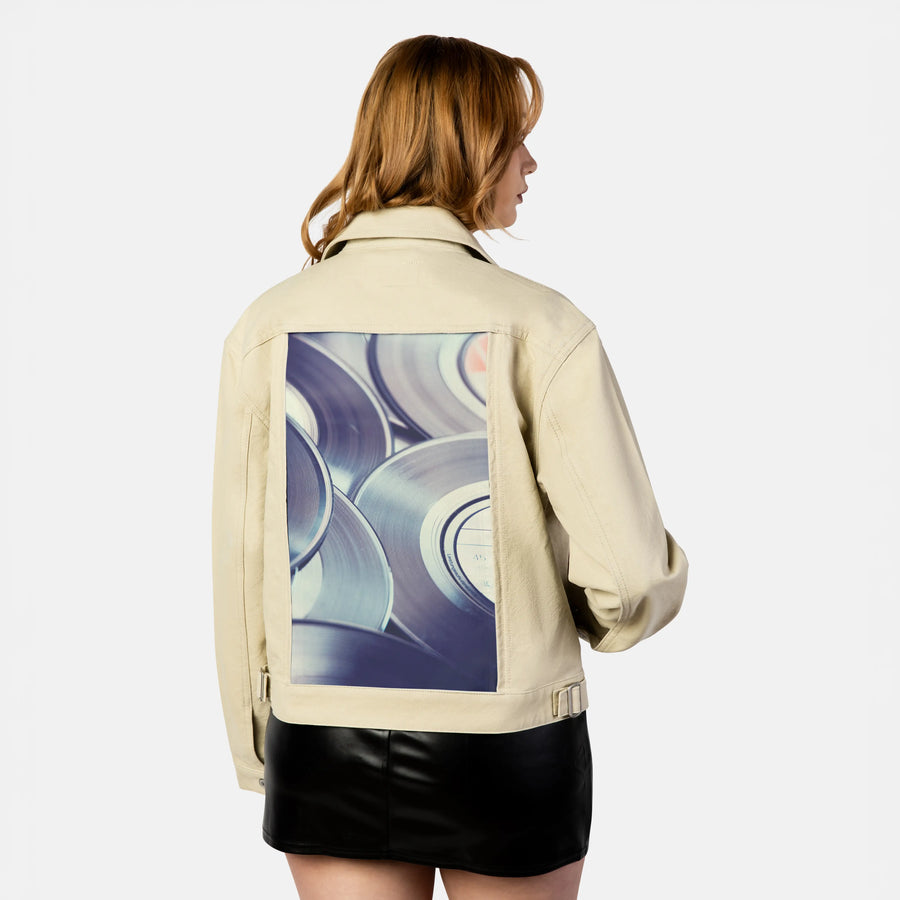 vinylsingles patch on female atelier canvas jacket in tan