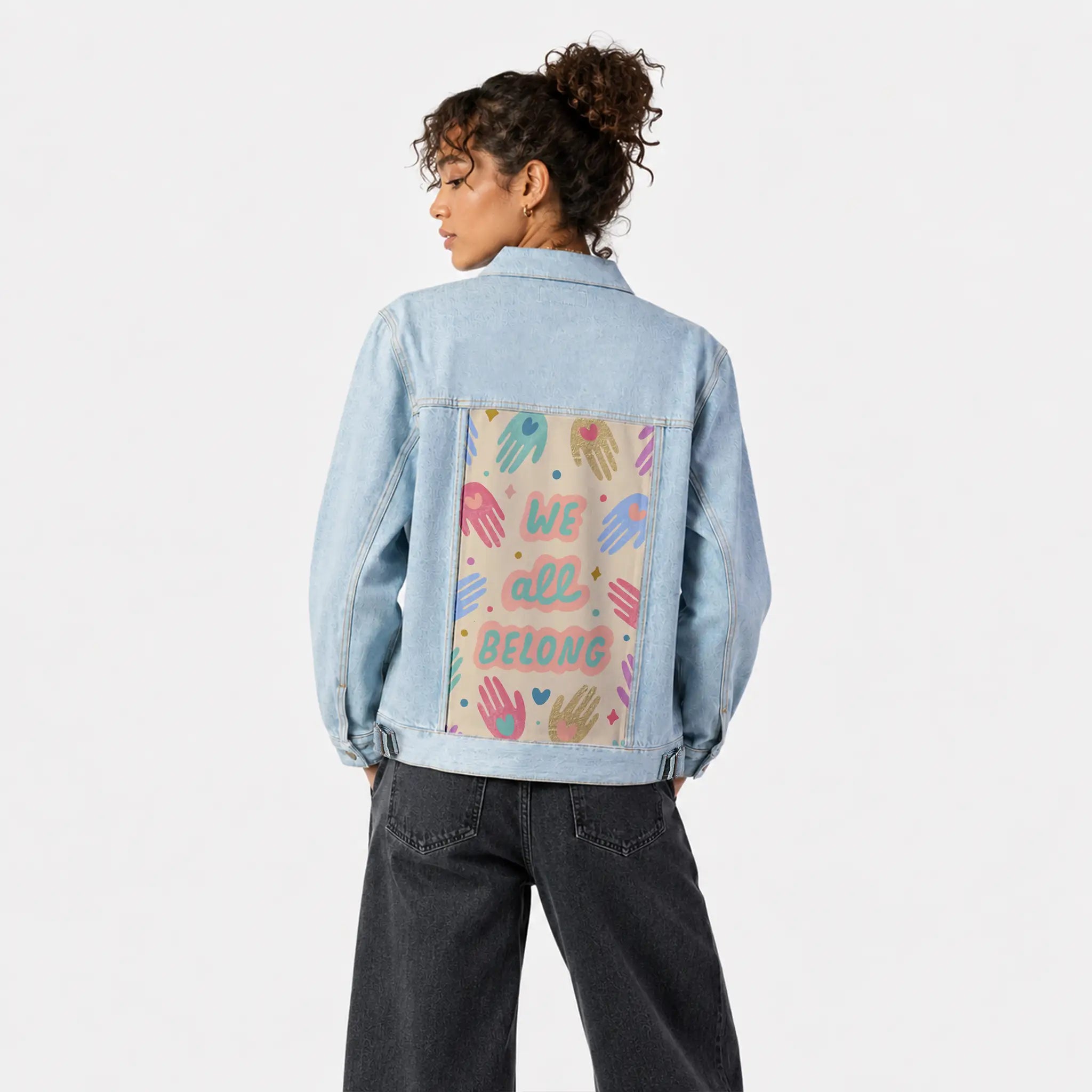 weallbelong patch on female og denim jacket in oceanside