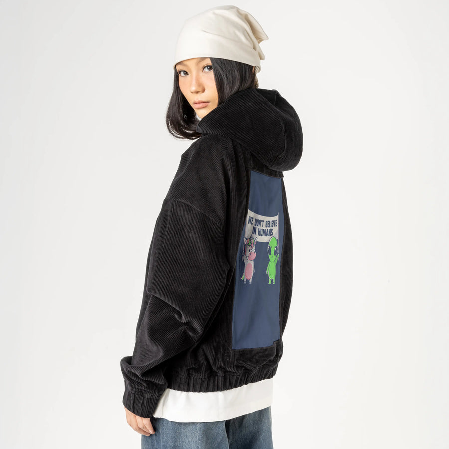 wedontbelieve patch on female retro cord hoodie in onyx