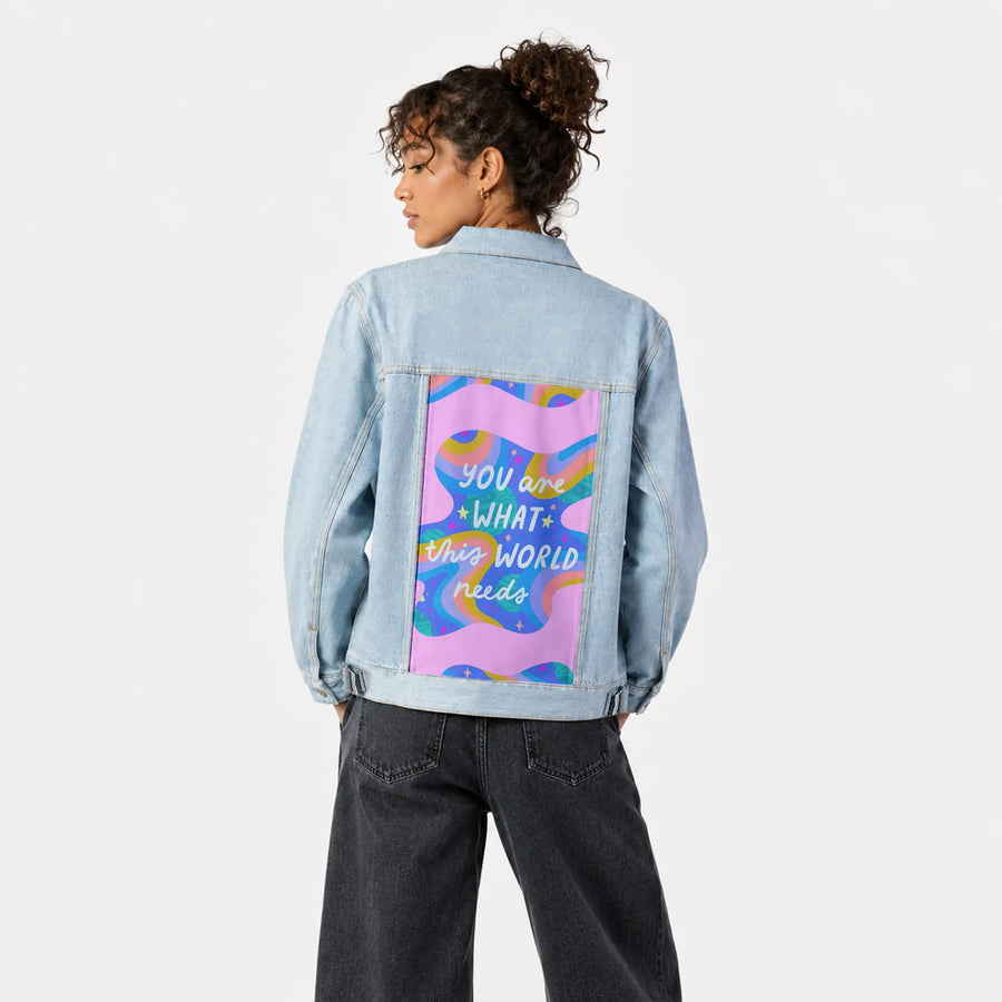 whatthisworldneeds patch on female og denim jacket in oceanside