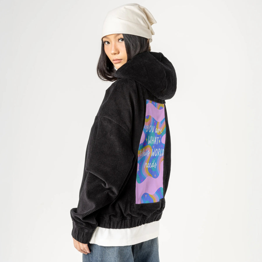 whatthisworldneeds patch on female retro cord hoodie in onyx