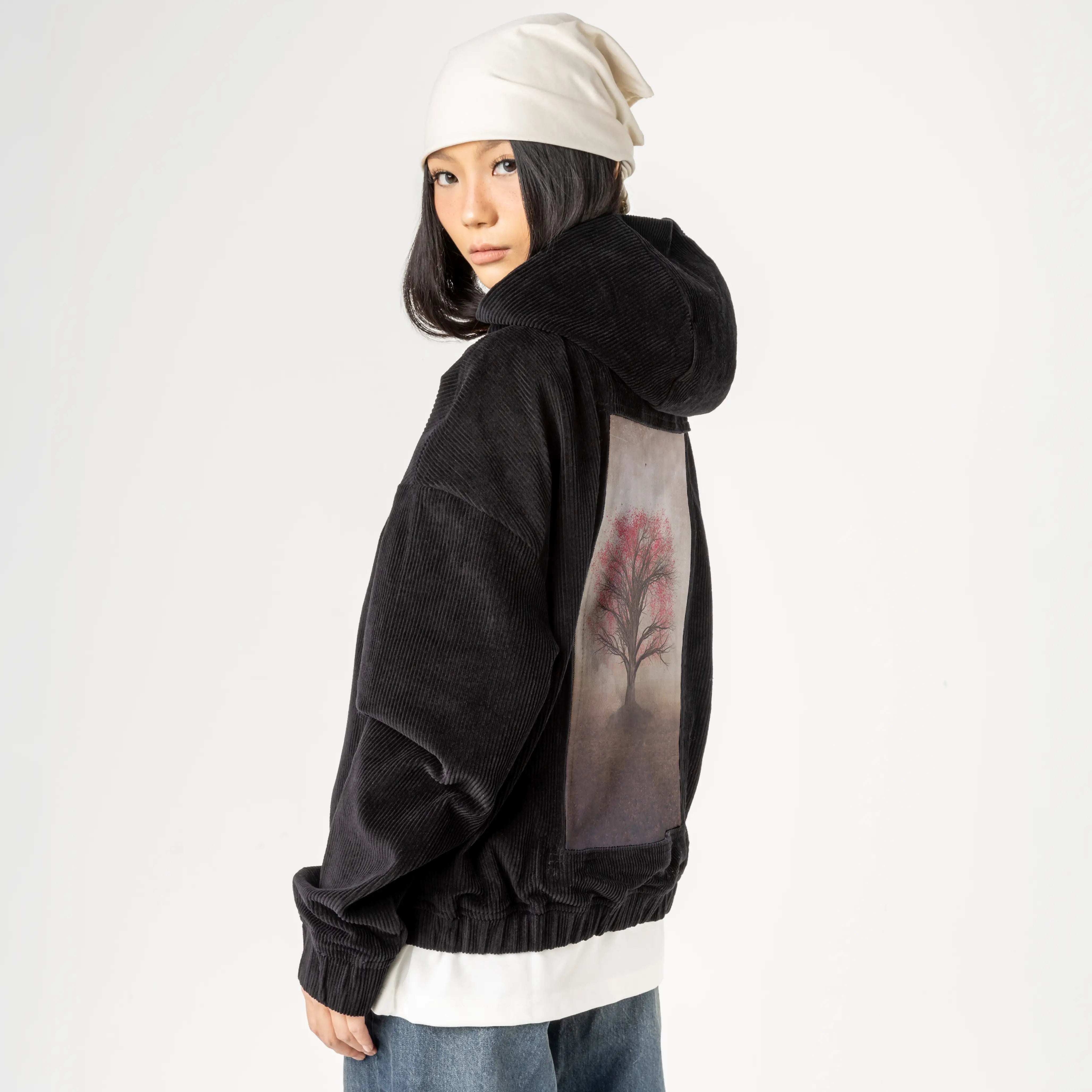 wondertree patch on female retro cord hoodie in onyx